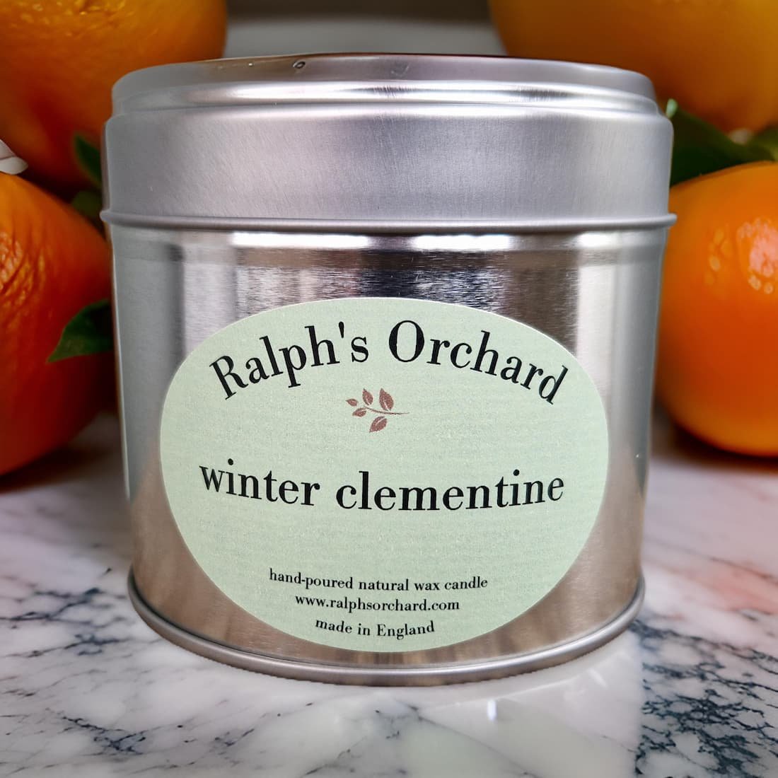 Ralph's Orchard Winter Clementine candle in a silver tin.