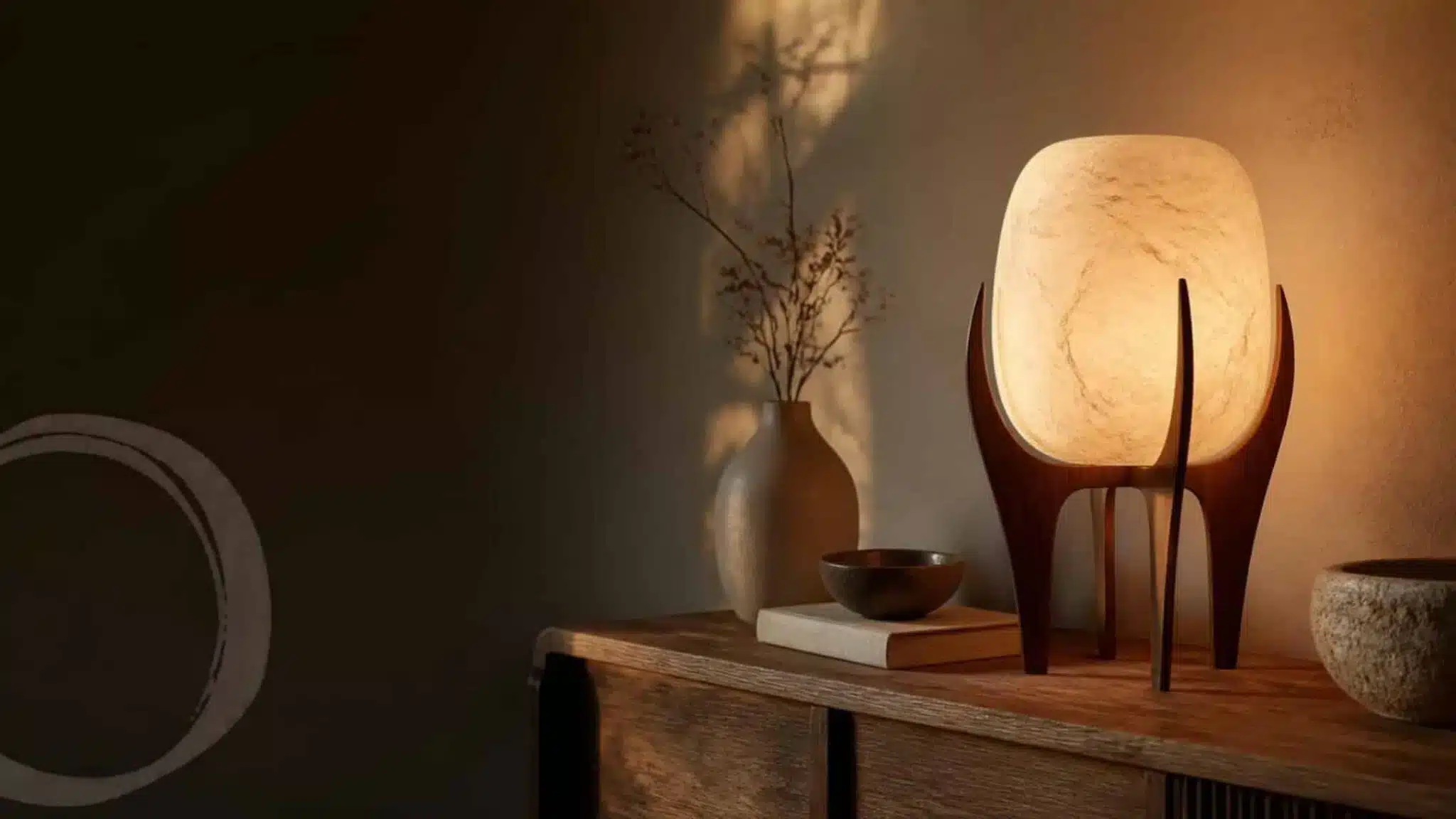 Wooden and ceramic table lamps with fabric shades in a warm interior